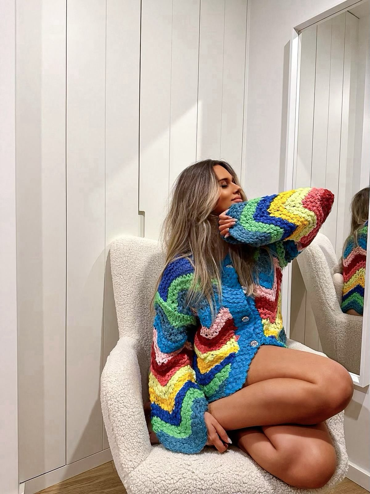 Colorful knitted cardigan in rainbow colors