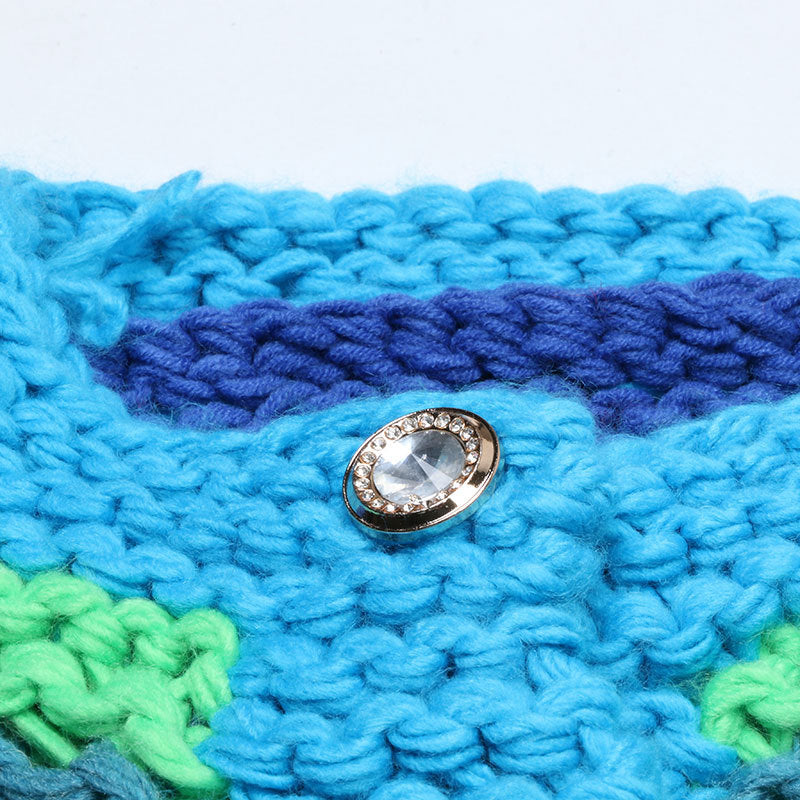 Button detail of the multicolor striped cardigan